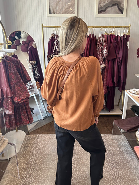 Drop shoulder blouse with smocked cuff