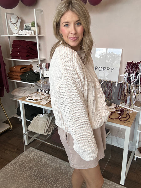 Exaggerated button crochet sweater